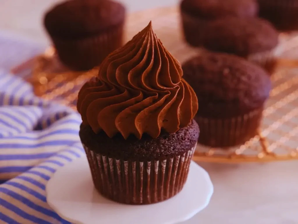 Delicious moist chocolate cupcakes with creamy frosting - a sweet delight for any occasion!