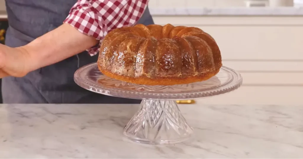 Delicious homemade butter cake with golden crust, served on a white plate, perfect dessert recipe for any occasion