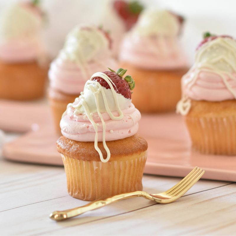 Colorful display of freshly baked cupcakes, featuring a variety of flavors and decorative toppings, representing the delightful assortment found in the Cupcakes category.